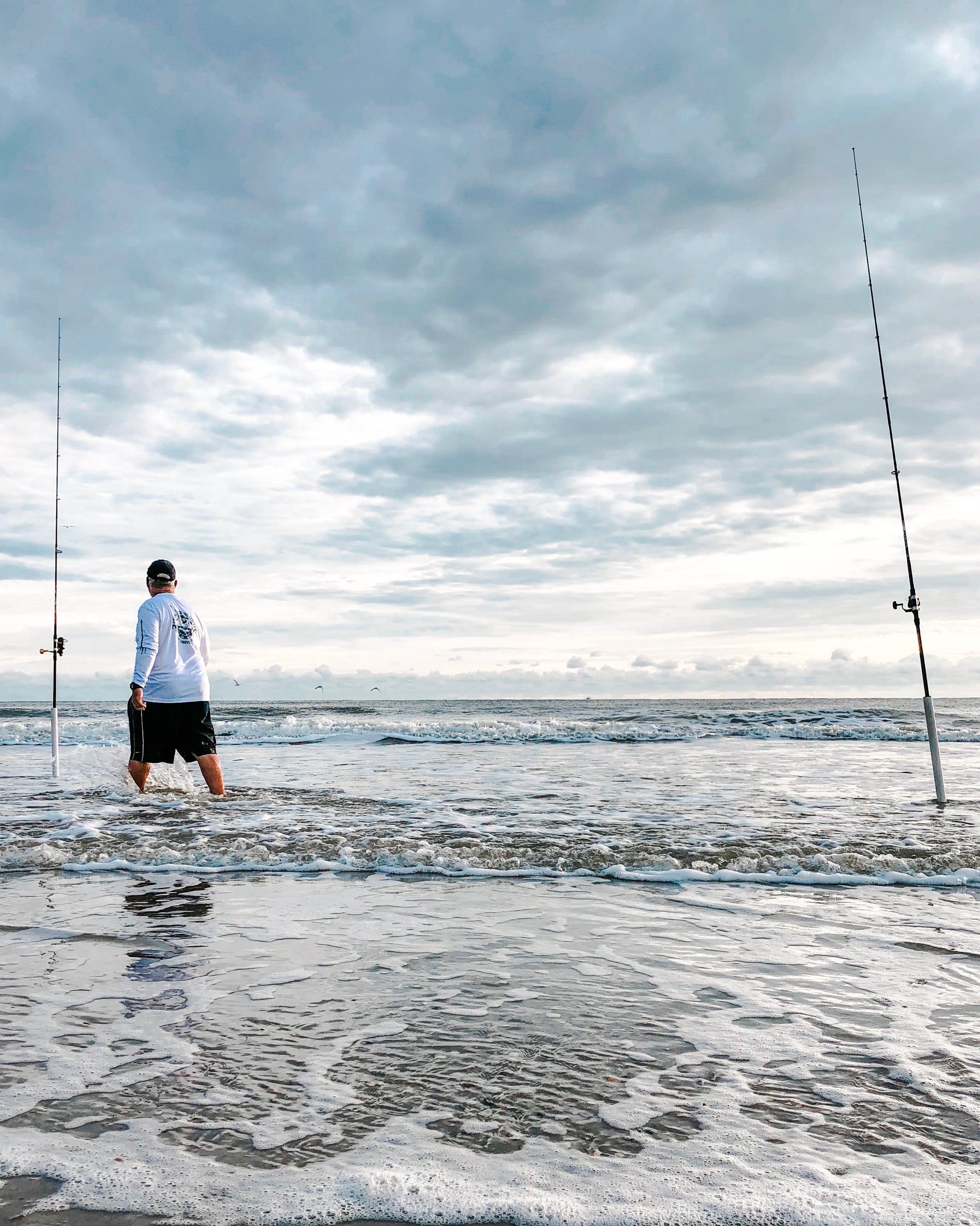 Morning time surf fishing with two rods 